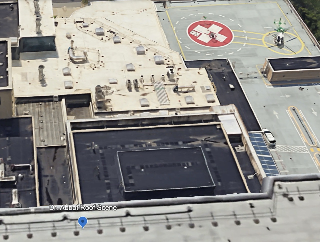 Arial imagery showing AGH rooftop with the hospital helipad in the background