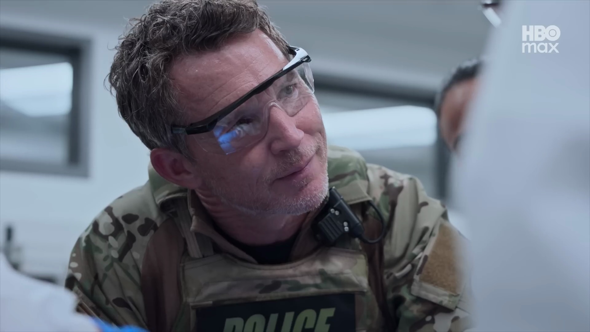 Dr. Abbot in a police uniform