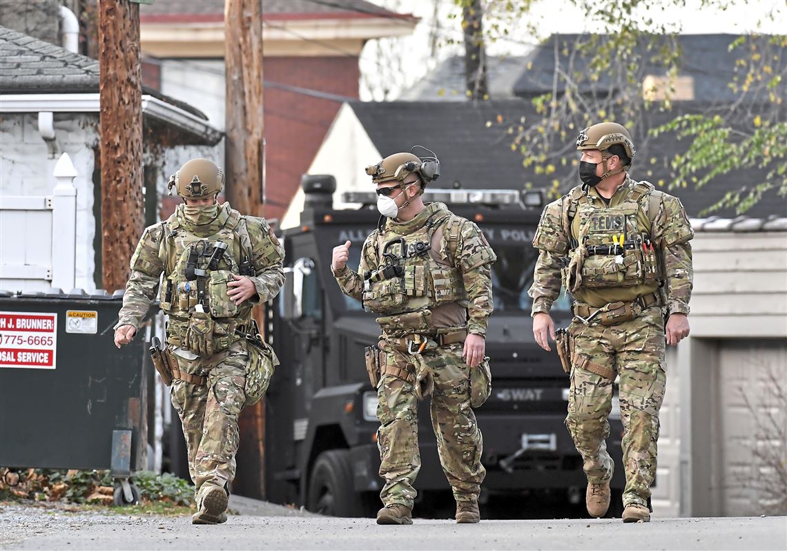 Three Pittsburgh TEMS members in uniform showing the TEMS logo on the front